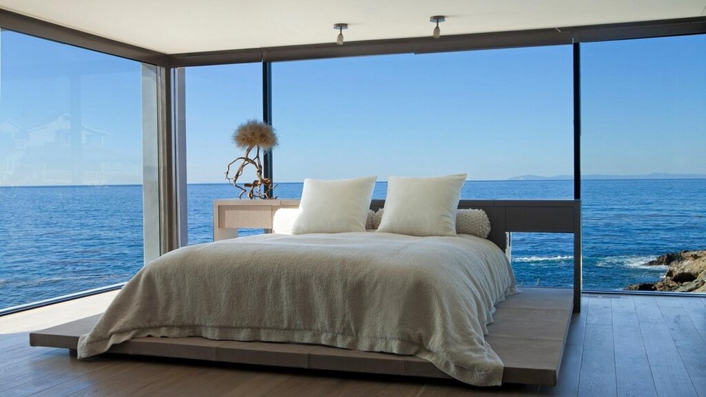 A bedroom with panoramic windows