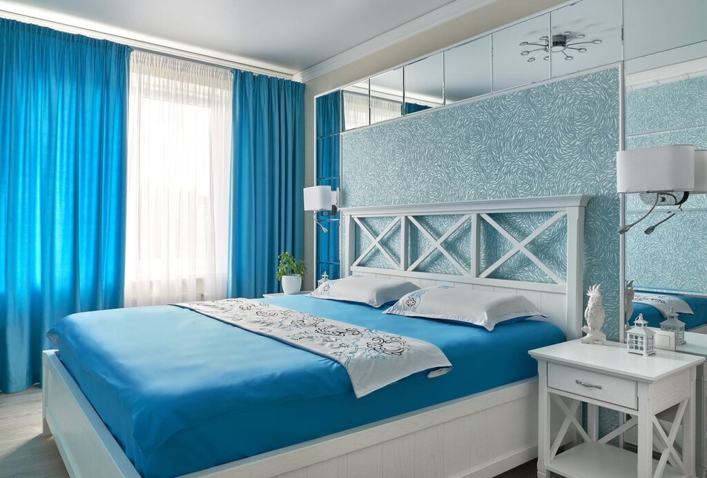 A bedroom in white and blue tones