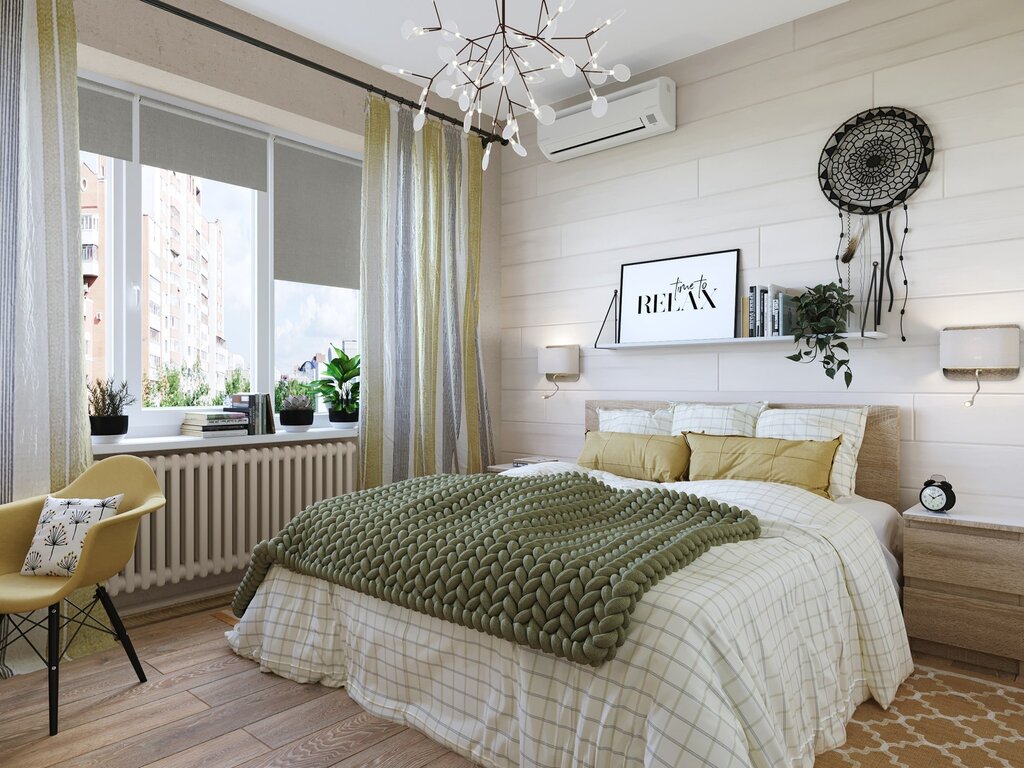 A bedroom in beige and green tones