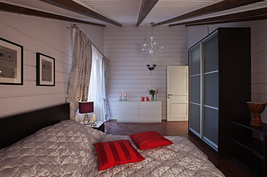 A bedroom in a house made of glued laminated timber