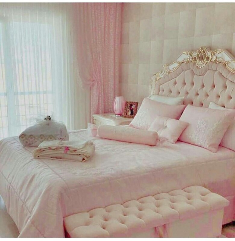 A bedroom in pink tones