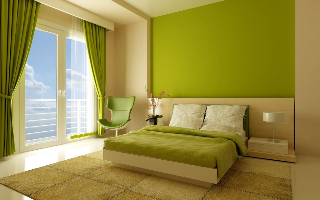 A bedroom in light green tones