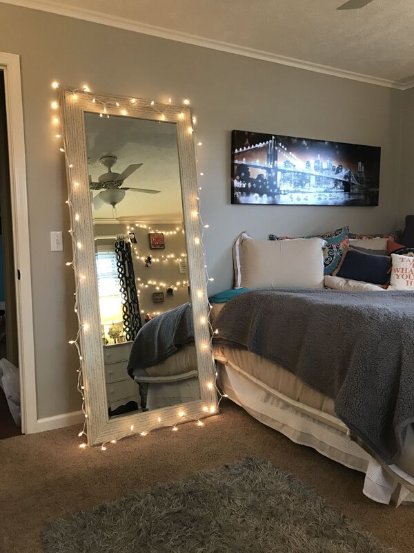 A wall with lighting in the bedroom