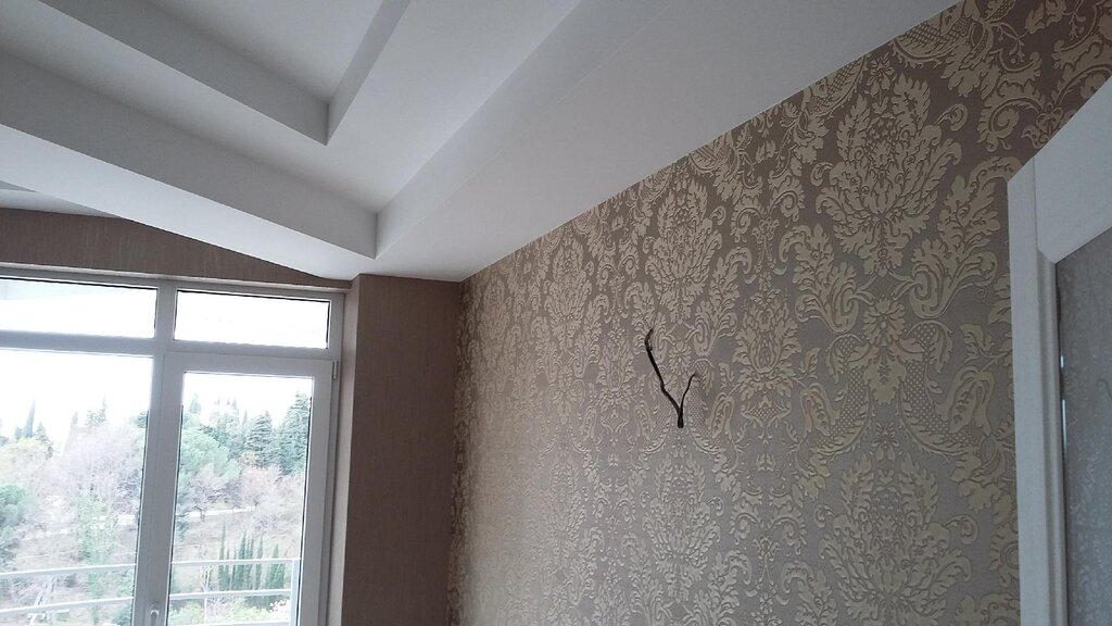 The junction of wallpaper and paint on the walls