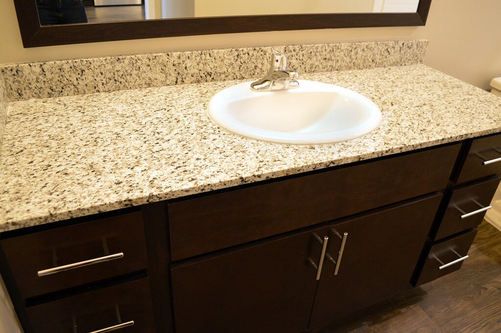 Countertop for a sink made of artificial stone