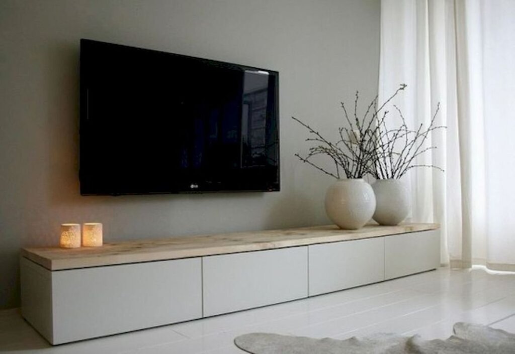 A countertop for a TV in the living room