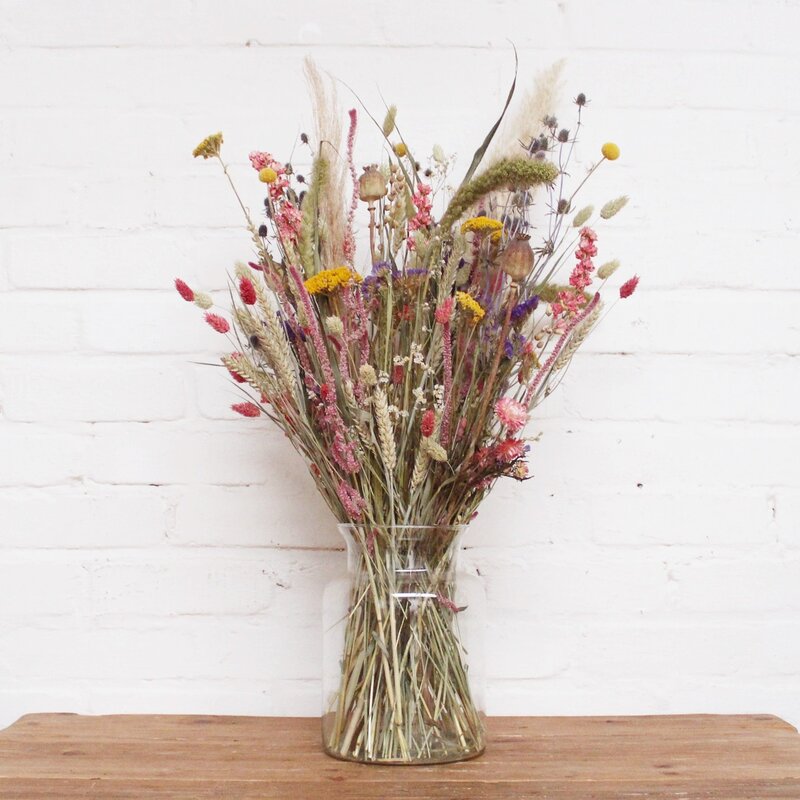 Dried flowers in a floor vase