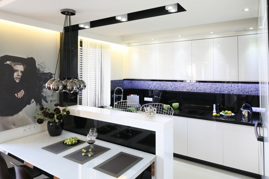 A bright kitchen with a black countertop