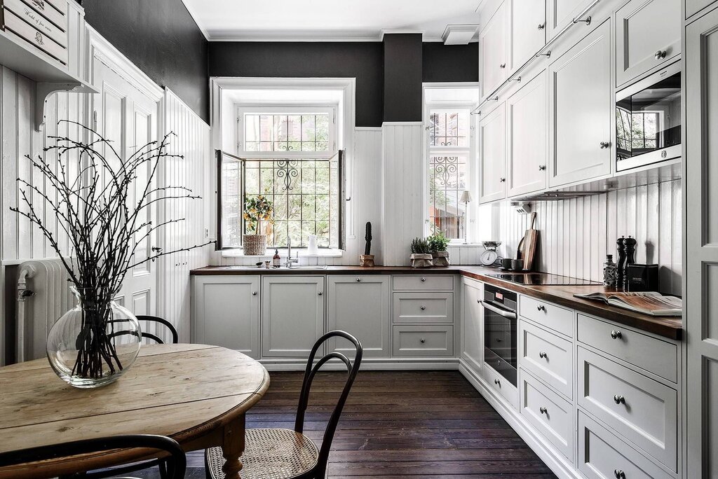 A bright kitchen with a wooden countertop