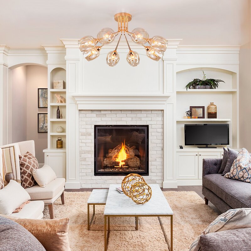 A television above the fireplace in the living room interior