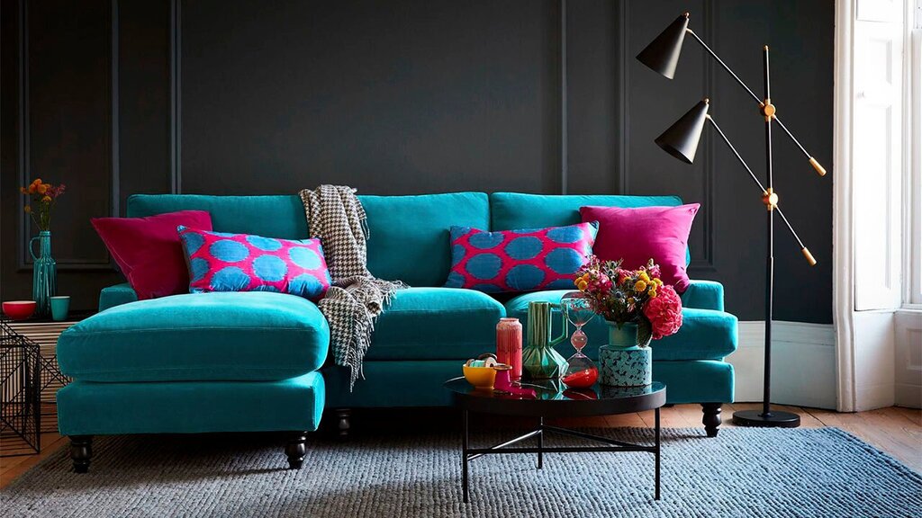 Dark turquoise sofa in the interior