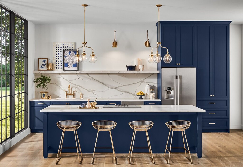 Dark blue kitchen with a wooden countertop