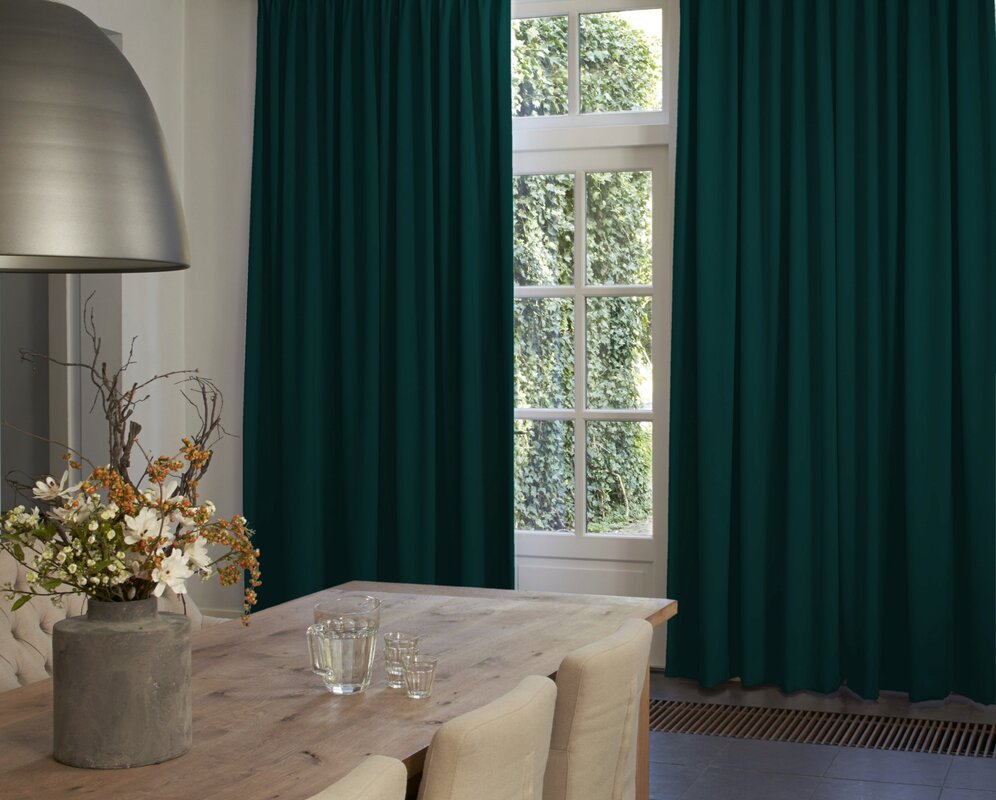 Dark green curtains in the interior