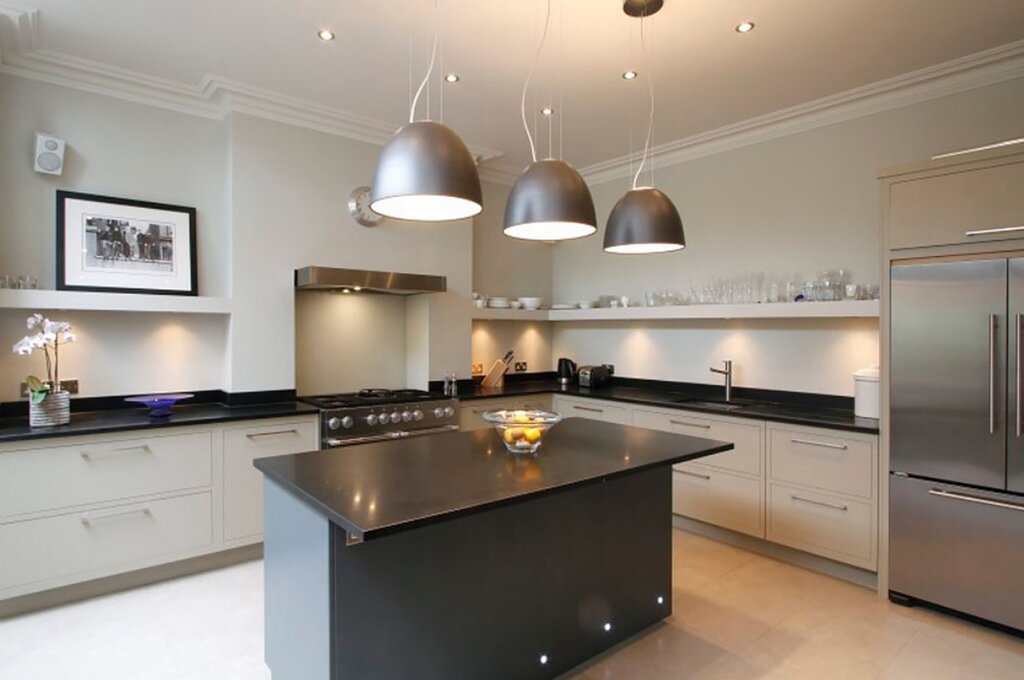 Recessed lights above the kitchen