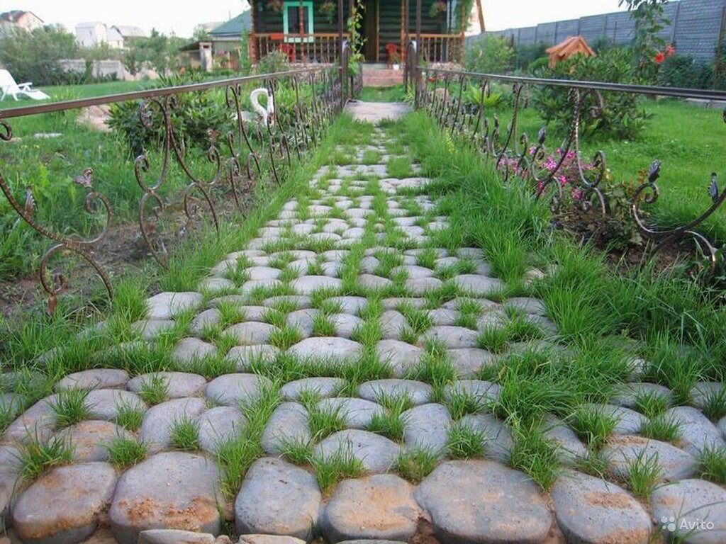 Paving stone with grass inserts