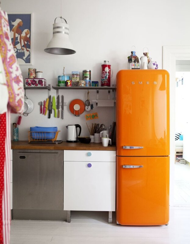 A colorful refrigerator in the interior