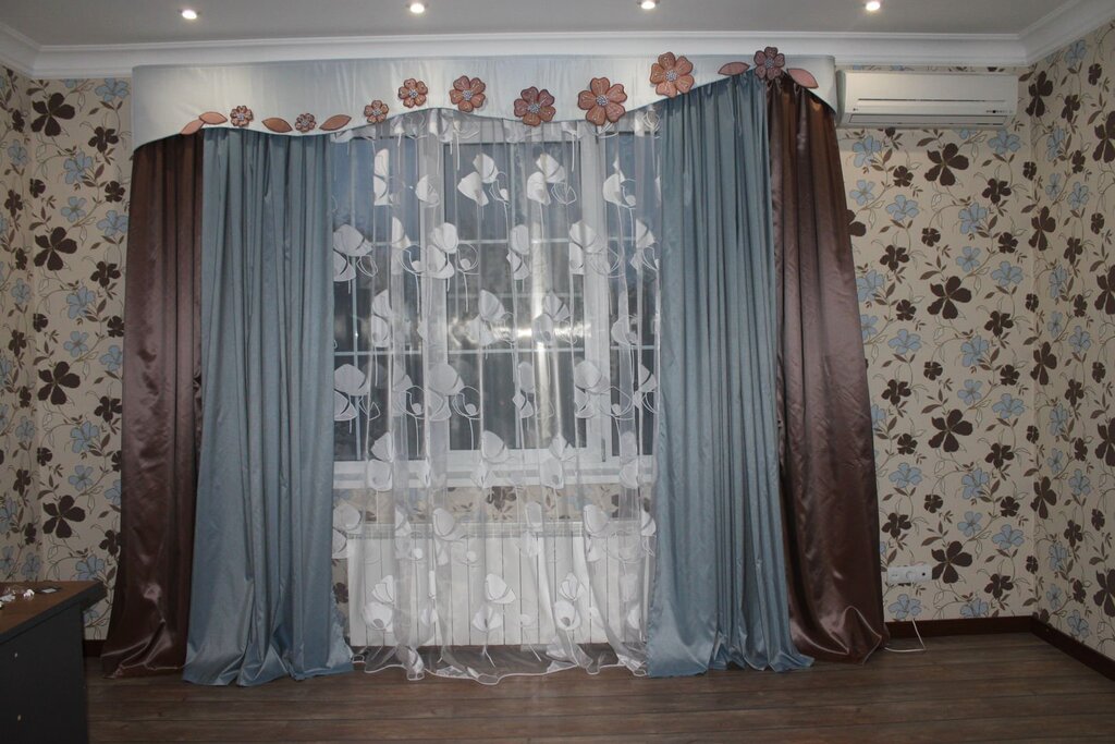 Sheer curtains over drapes