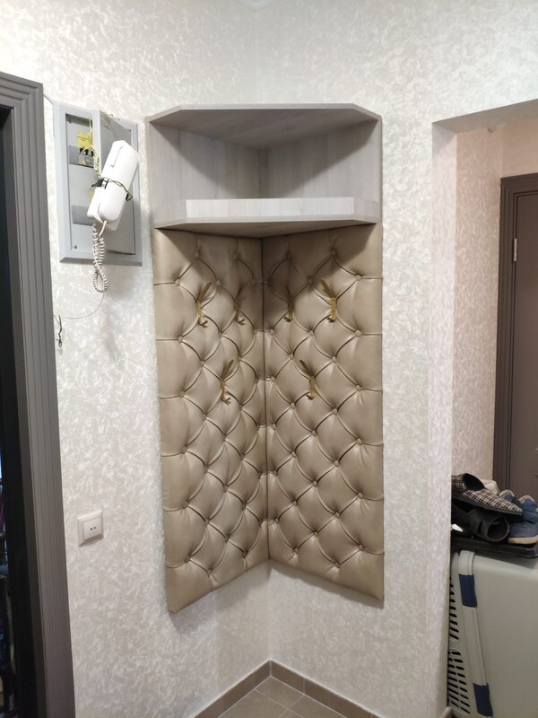 Corner hallway with tufted upholstery