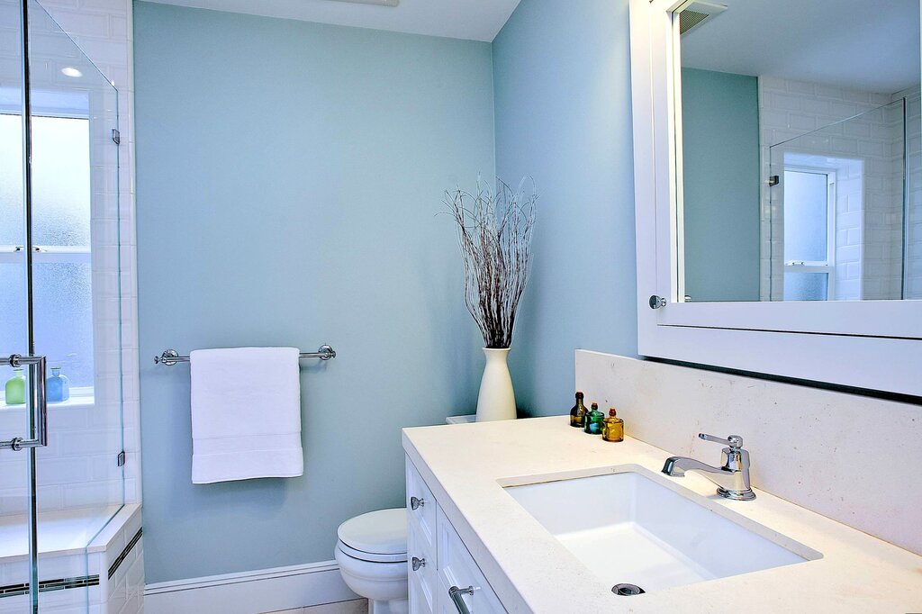 A bathtub with painted walls