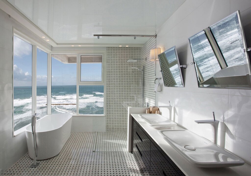 A bathtub with a sea view