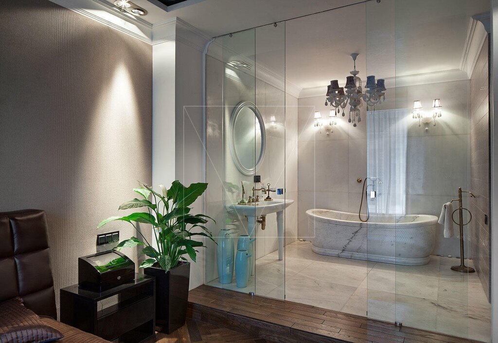 The bathroom with a glass wall