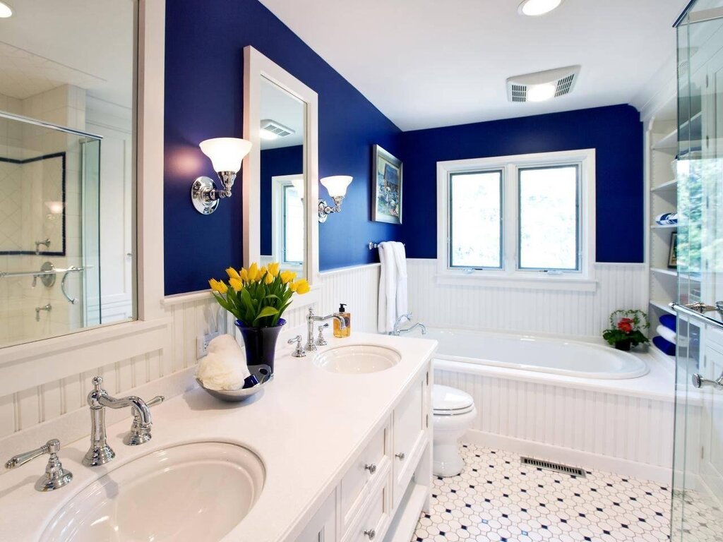 A bathroom with painted walls and tiles