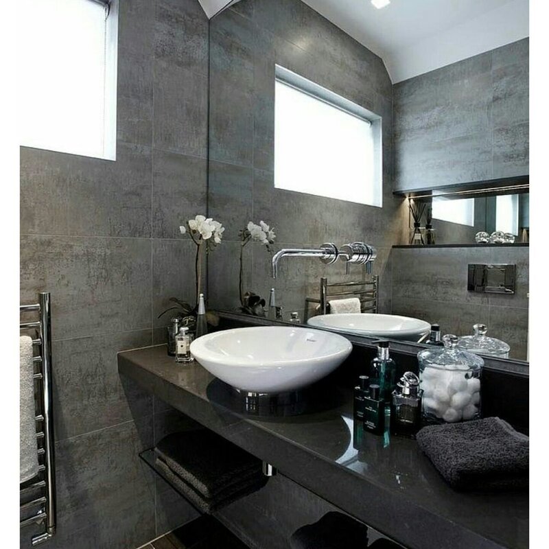 The bathroom in dark gray tones