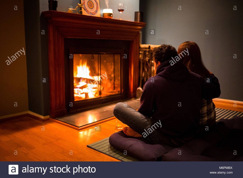 Lovers by the fireplace