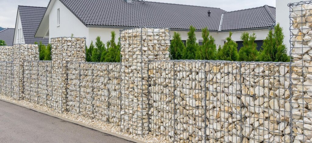 A fence made of stones in a mesh