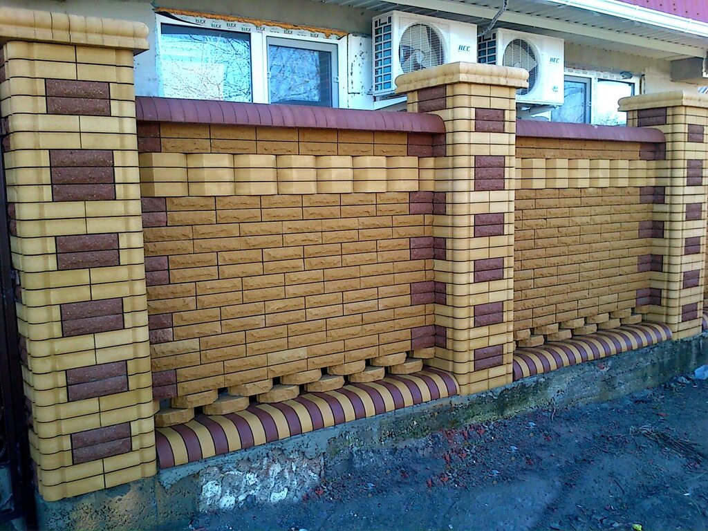 A fence made of brick and stone