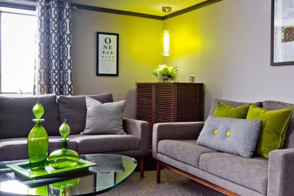 Green sofa in a gray interior