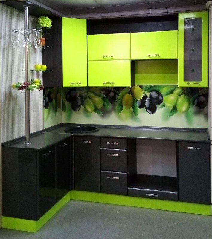 Green kitchen with a black countertop