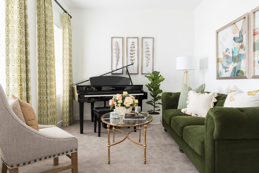 A green sofa in the living room interior