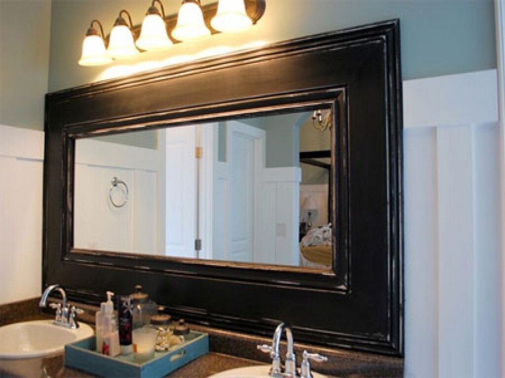 Mirror in a frame for the bathroom