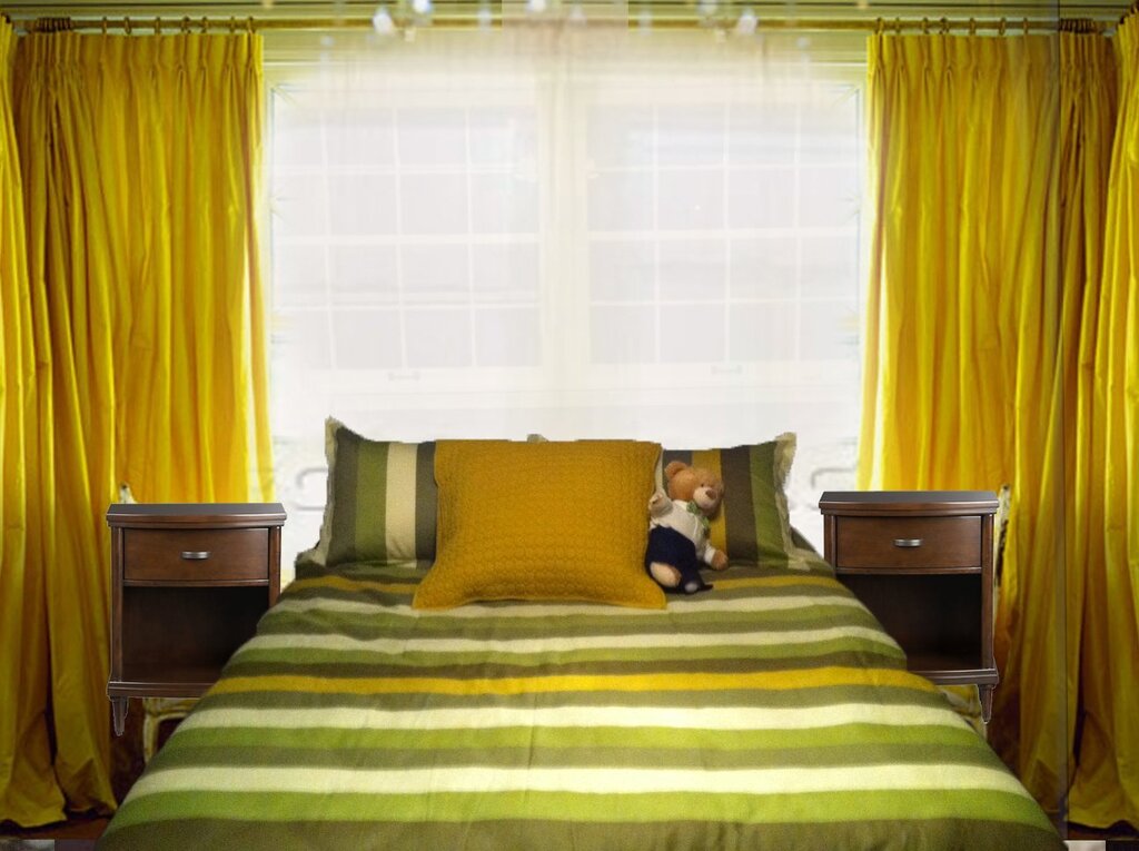 Yellow curtains in the bedroom interior