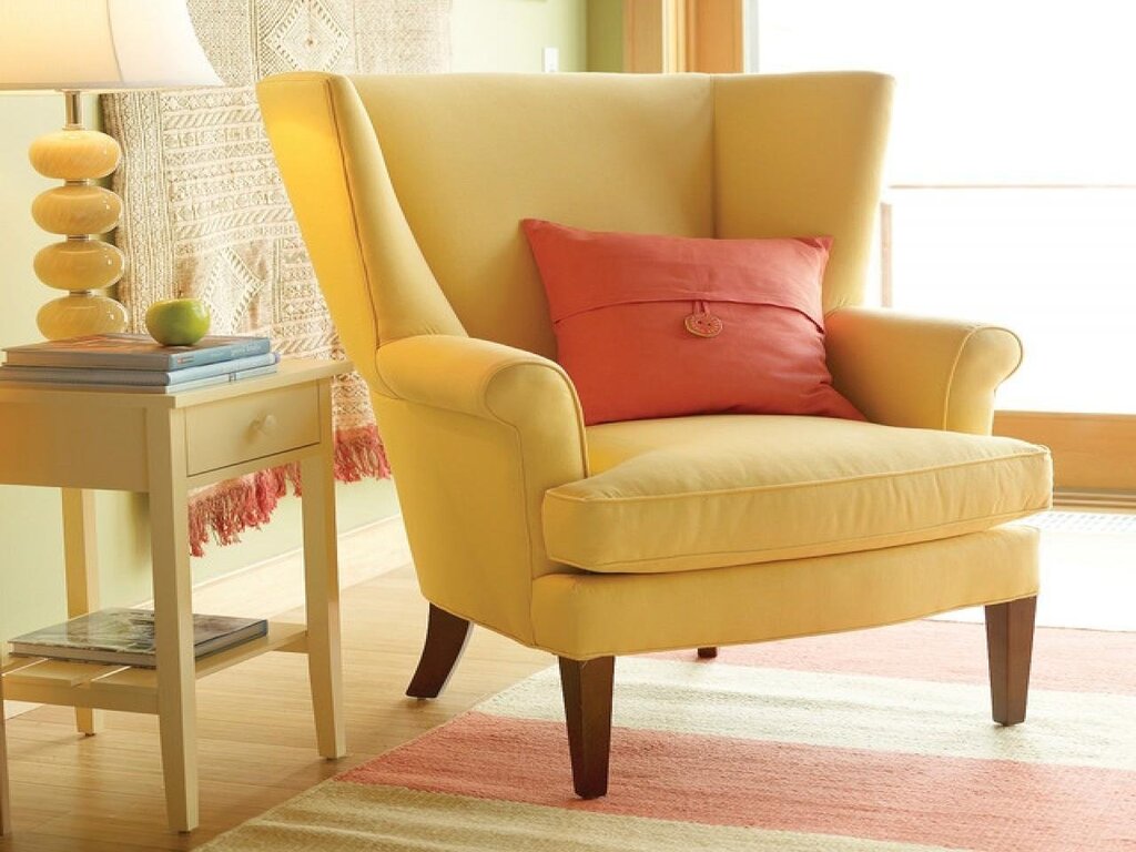 A yellow armchair in the living room interior